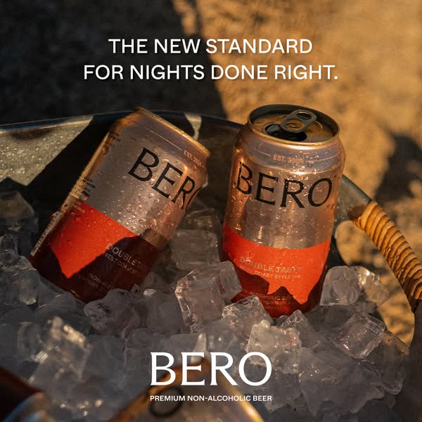 An image ad showcasing two cans of BERO premium non-alcoholic beer in a bucket of ice. The ad highlights the product as 