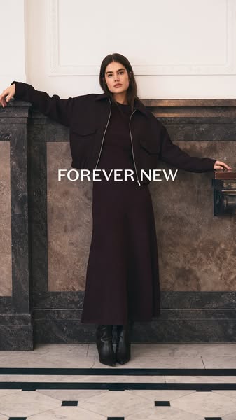 This image ad promotes the Forever New brand by showcasing a woman wearing a dress and bomber jacket from their latest c