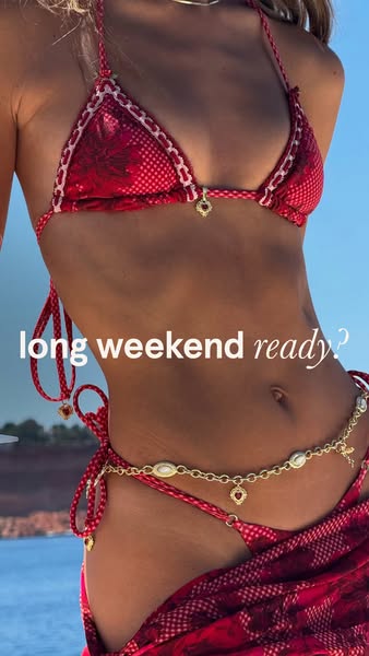 An image ad showing the torso of a woman wearing a red and white bikini and a gold chain belt with a caption that reads 