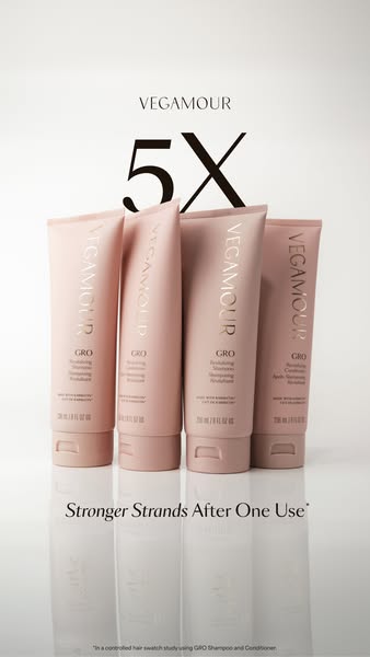 The ad features Vegamour's GRO Revitalizing Shampoo and Conditioner, highlighting its ability to strengthen strands 