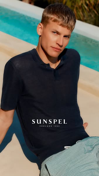 This image shows a man wearing a Sunspel polo shirt, positioned to evoke a sense of relaxed luxury and timeless style.