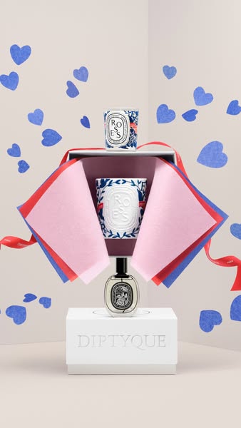 The ad displays a gift set with Diptyque fragrances and candles, emphasizing their presentation as a thoughtful gift.