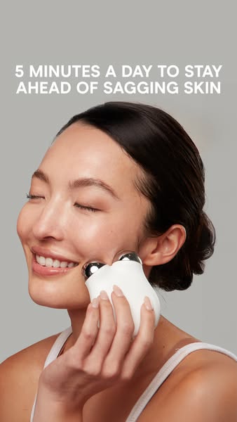 An ad featuring a woman using a device on her face that aims to reduce sagging skin.