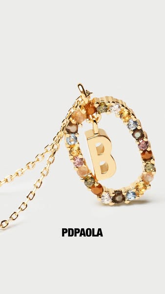 This image ad showcases the PDPaola necklace with the letter 'B'.