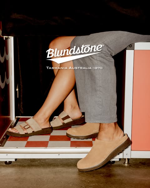 This ad showcases two styles of Blundstone footwear being worn by a male and female in what appears to be a photo booth.