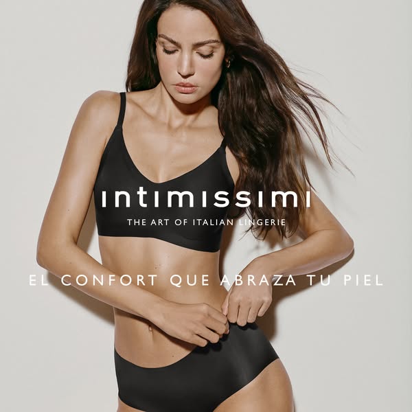 This image promotes lingerie from Intimissimi. A woman is shown wearing a black bra and underwear set. The ad highlights