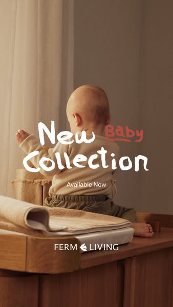 This ad showcases Ferm Living's new baby collection. It features a baby sitting on a wooden changing table or dresse