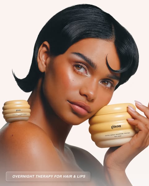 This ad features a woman holding a Gisou hair mask. The ad promotes the Gisou Honey Gloss Ceramide Therapy Hair Mask as 