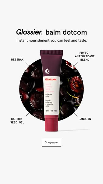 This ad features a Glossier Balm Dotcom product in the Dark Cherry flavor. The product is showcased in the center of the