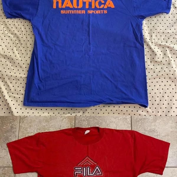 This ad features two t-shirts, one blue and one red, laid out on a patterned surface. The blue shirt has the brand name 
