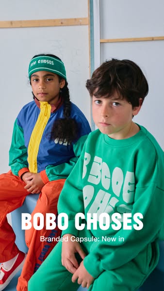 This image ad features two children wearing clothing from the BOBO CHOSES branded capsule: new in collection.