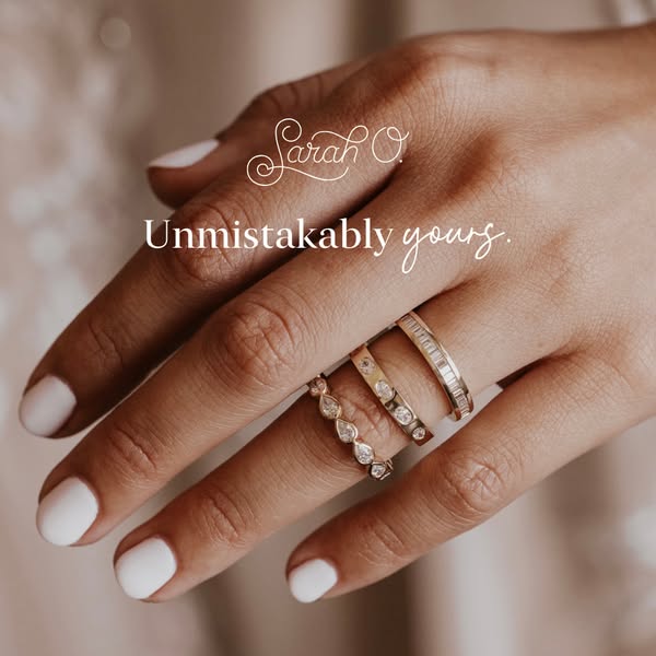 This image ad showcases an assortment of gold rings by Sarah O. Jewelry. The ad’s headline is, "Unmistakably yours.