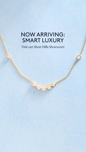 This ad showcases a gold necklace with diamonds and encourages viewers to visit the Short Hills Showroom.