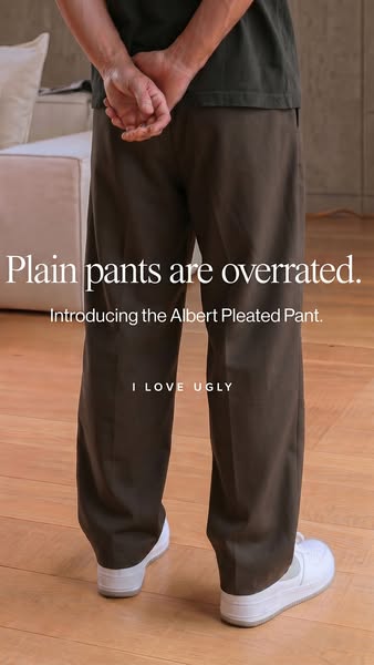 This image ad features a person wearing the Albert Pleated Pant by I Love Ugly. The ad emphasizes the pants' unique 