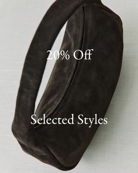 The ad showcases a brown bag with the text '20% Off Selected Styles'.