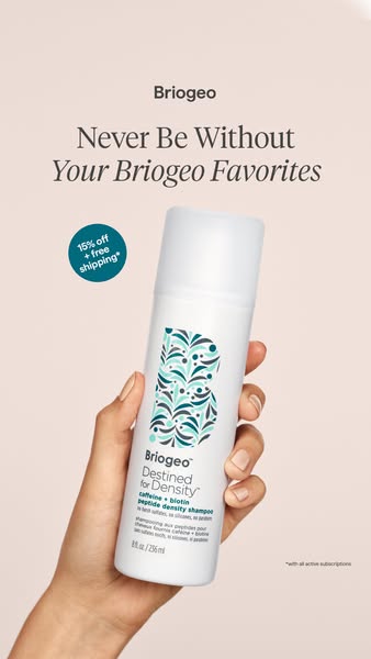 This ad for Briogeo's Destined for Density peptide density shampoo features a hand holding the product bottle. The a