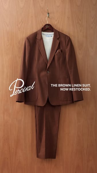 This ad showcases the brand Percival's brown linen suit, now restocked. The ad is designed to be simple and elegant,