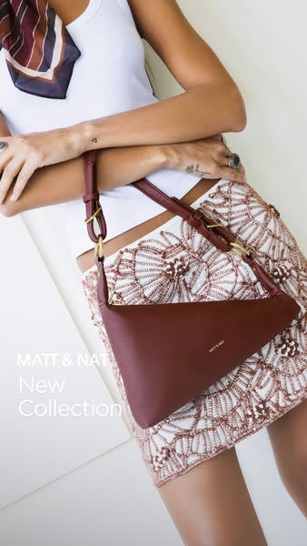 This ad highlights a new collection of bags from Matt & Nat. A woman is shown wearing a red bag from the new collect