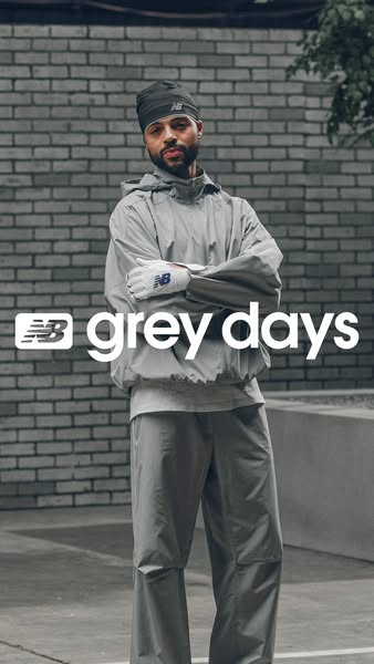 This image ad for New Balance's 'Grey Days' collection features a model wearing a grey New Balance outfit in