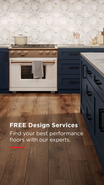 This image ad promotes design services for performance floors. It features a kitchen setting with wood floors and text o