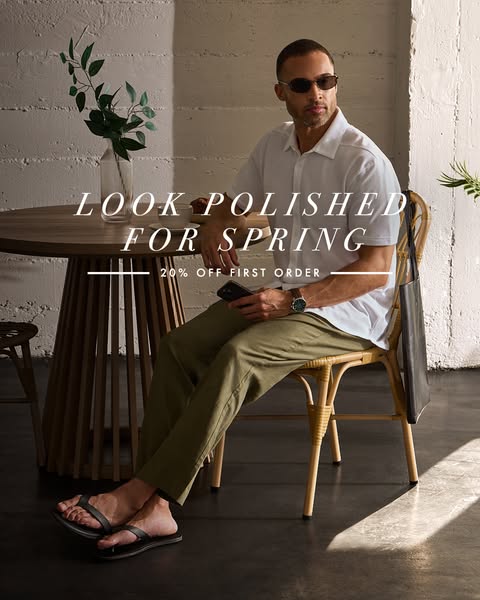 An ad for men's clothing with an offer for 20% off the first order. It showcases a man sitting at a table wearing a 