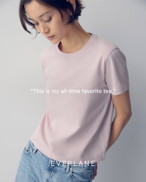 This ad for Everlane features a woman wearing a lilac-colored t-shirt with the Everlane logo at the bottom. She wears th