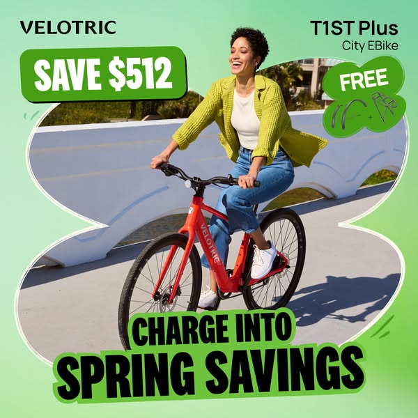 The ad features a woman happily riding a VELOTRIC T1 ST Plus City EBike on what appears to be a city bike path. The ad p