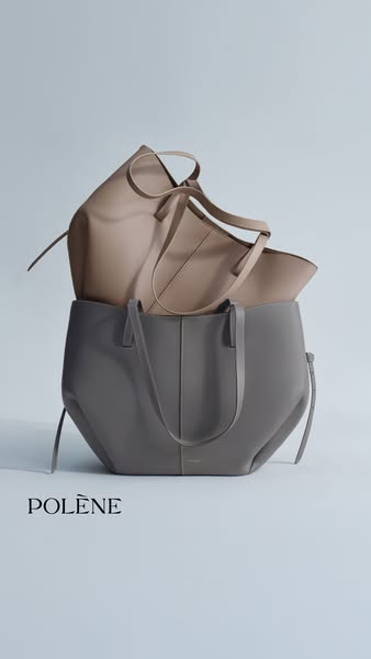 This image ad showcases two Polène handbags, one beige and one gray, stacked on top of each other against a light blue b