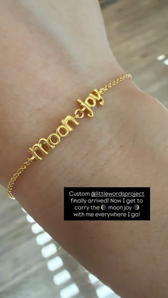 This ad features an image of a gold bracelet from the brand Little Words Project that says "moon-joy". The ima