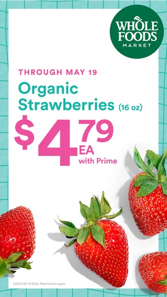 This is an image ad promoting a sale on organic strawberries at Whole Foods Market for Prime members. The sale is availa