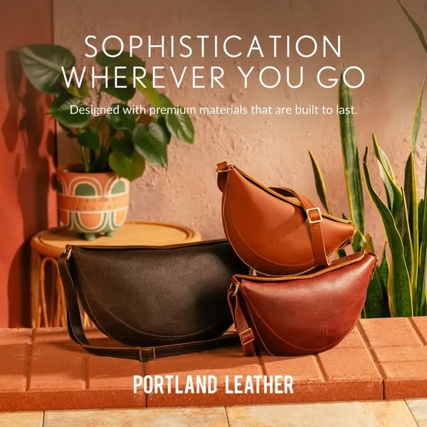 This image ad for Portland Leather features three half-moon shaped bags in varying colors, arranged on a brick surface a