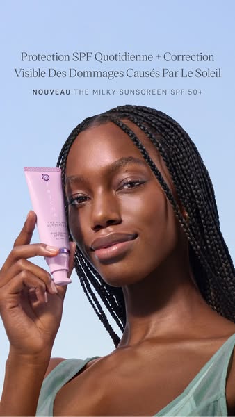 This ad is for Tatcha's The Milky Sunscreen SPF 50+. The ad features a woman holding the product with ad copy callin