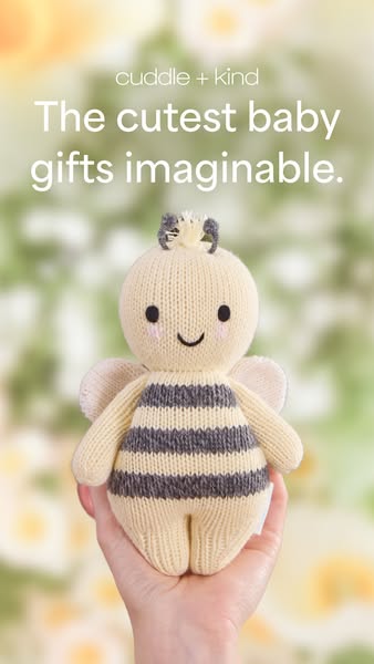 This ad promotes Cuddle + Kind's handcrafted dolls, specifically highlighting their suitability as baby gifts.
