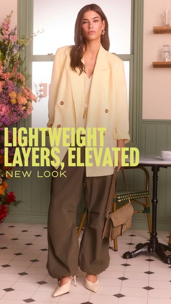 This New Look ad showcases lightweight, elevated layered clothing, featuring a model wearing a double-breasted blazer, l
