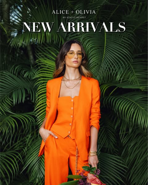 This Alice + Olivia ad showcases new arrivals against a tropical backdrop. The image features a model wearing a bright o