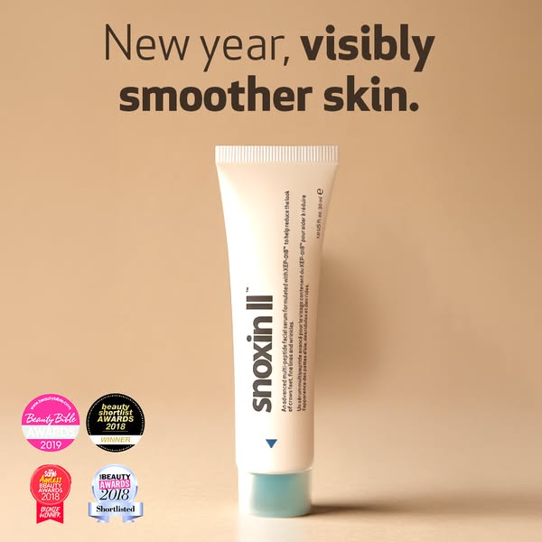 This ad promotes Snoxin II, a multi-peptide facial serum designed to visibly smooth skin in the new year. The ad feature