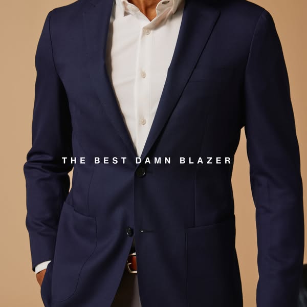 This ad showcases a navy blue blazer, emphasizing its quality and style. The ad features a close-up shot of a man wearin