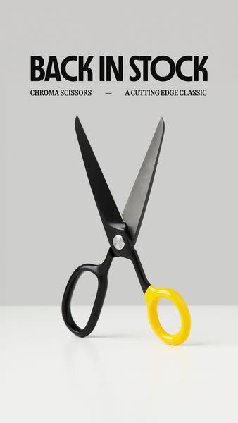 A minimalist ad showing a pair of scissors against a gray background. The ad indicates that the product is back in stock