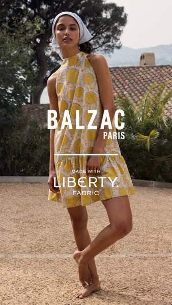 This image ad features a woman modeling a Balzac Paris dress made with Liberty fabric. The ad is likely aimed at women i