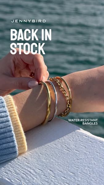 This ad for Jenny Bird features a woman layering water-resistant bangles on her arm. The ad emphasizes the bangles are b