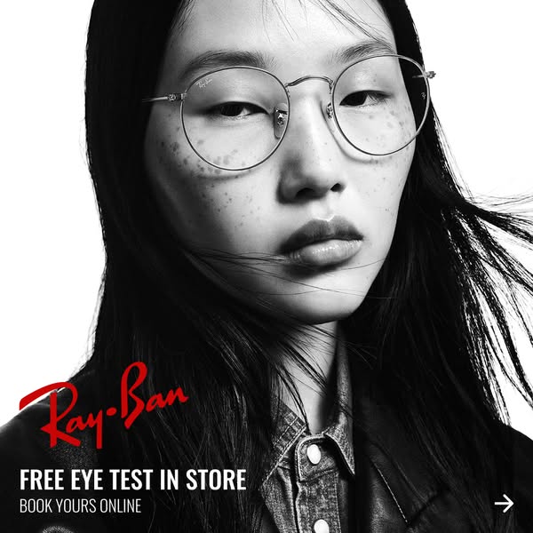 This ad for Ray-Ban features a black and white close-up of a model wearing Ray-Ban glasses. The ad promotes a free eye t