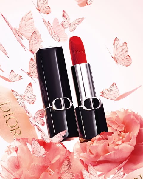 A product shot showcasing Dior lipstick surrounded by butterflies and flowers.