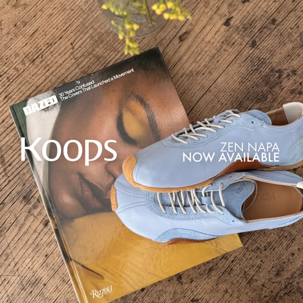 This ad features a pair of light blue Koops sneakers alongside a Dazed magazine on a wood surface. The ad is designed to