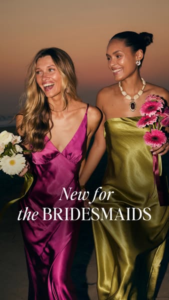 An image ad promoting bridesmaid dresses features two women smiling and holding flowers while wearing satin dresses. The