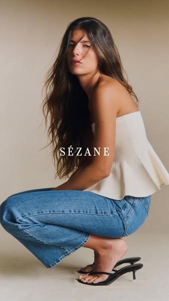 An image ad for Sezane featuring a model wearing their clothing.