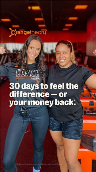 This image ad for Orangetheory Fitness shows two women standing side-by-side in a gym setting, flexing their arms. The a