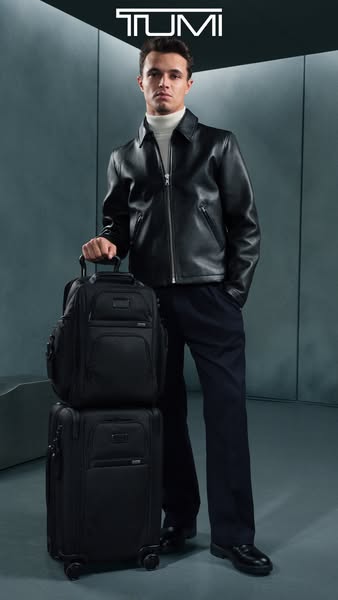This ad features the brand Tumi, showcasing a black backpack and carry-on suitcase. A man is standing behind the stacked