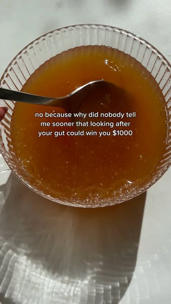 This ad features a clear bowl filled with an amber liquid. A spoon is inside the bowl. Text overlay suggests looking aft