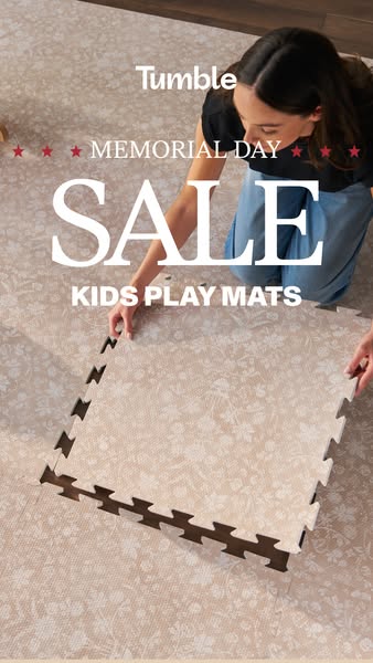 This ad for Tumble kids play mats promotes a Memorial Day sale on the mats. The ad features an adult woman's hands p