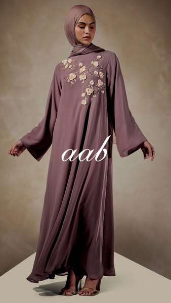 This ad features a woman wearing a long sleeve dress and hijab. The ad promotes a particular brand of clothing.